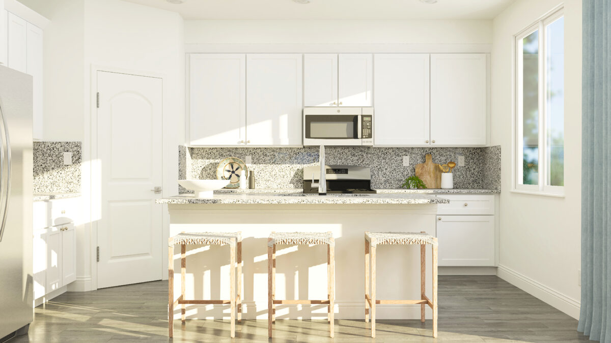 Kitchen island with stools, cabinets and view of cabinets and appliances.