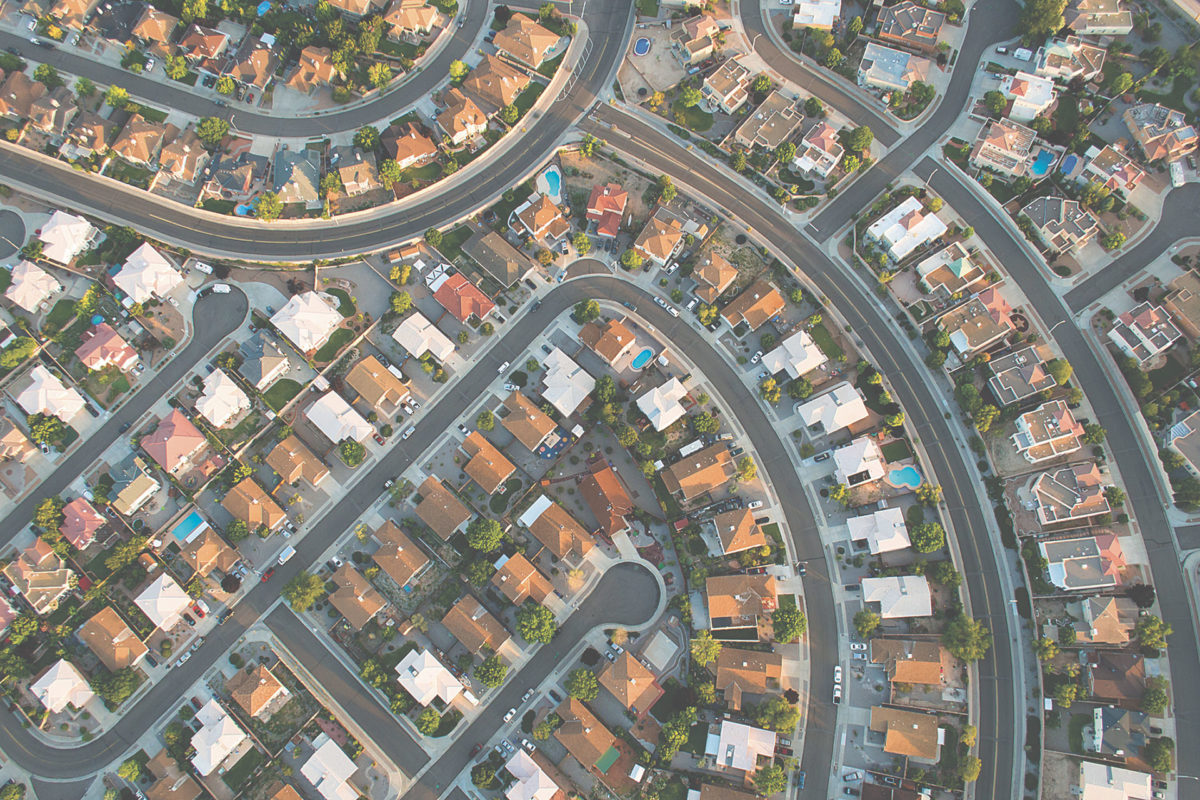 Aerial view of master planned community of single-family homes.