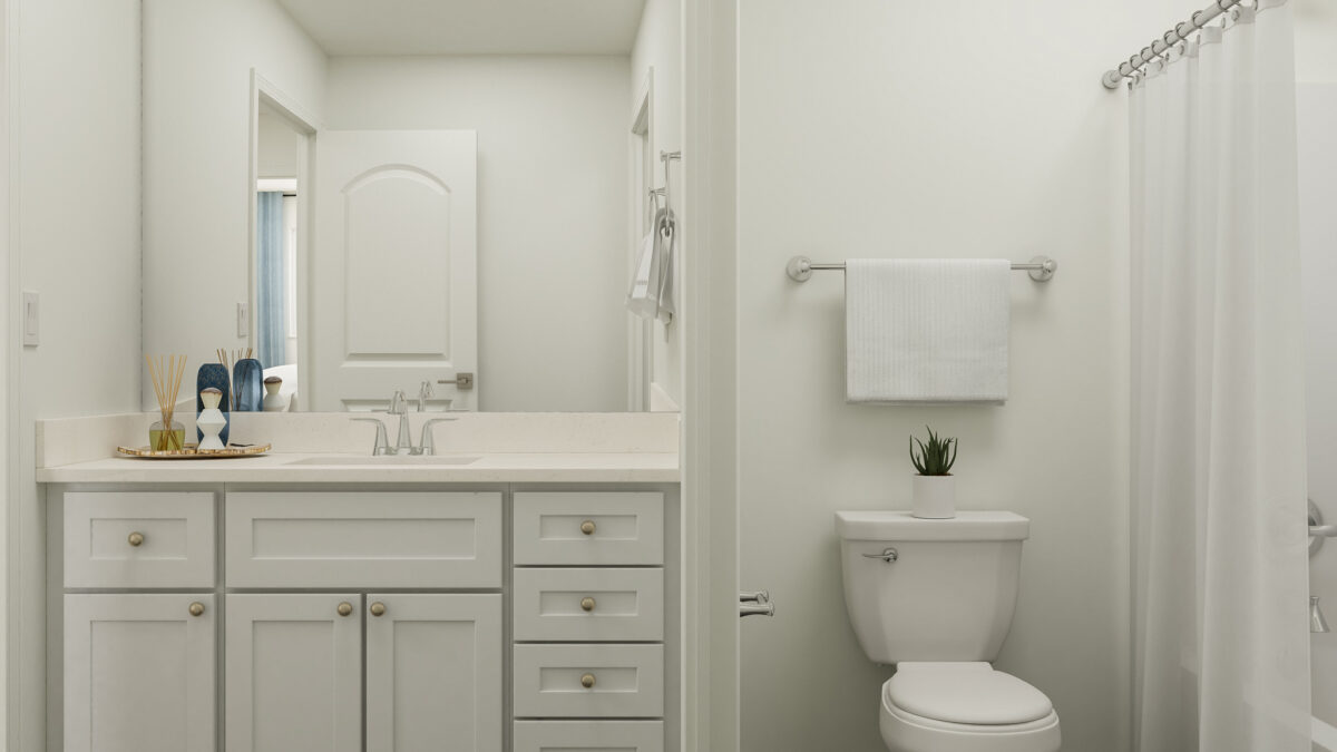 View of second floor bathroom with vanity, sink, shower and toilet