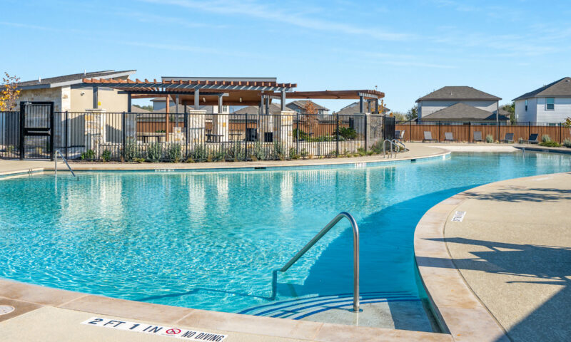 Photo of pool area, amenity center and pavilion.