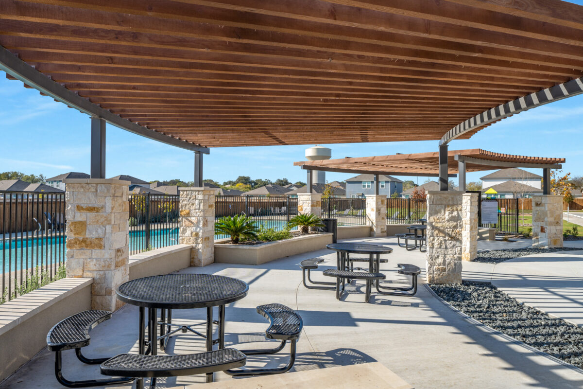 View of outdoor pavilion with shaded seating area.