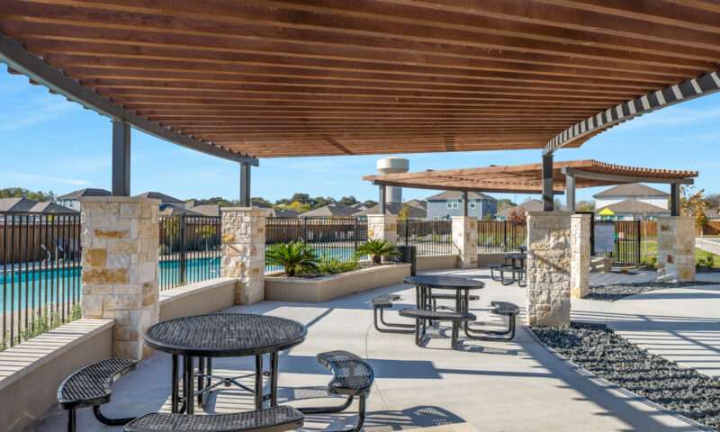 View of outdoor pavilion with shaded seating area.