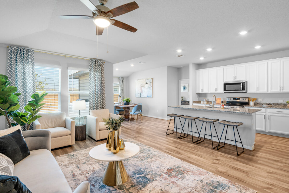 View of living space with focus on kitchen and dining area in the background.