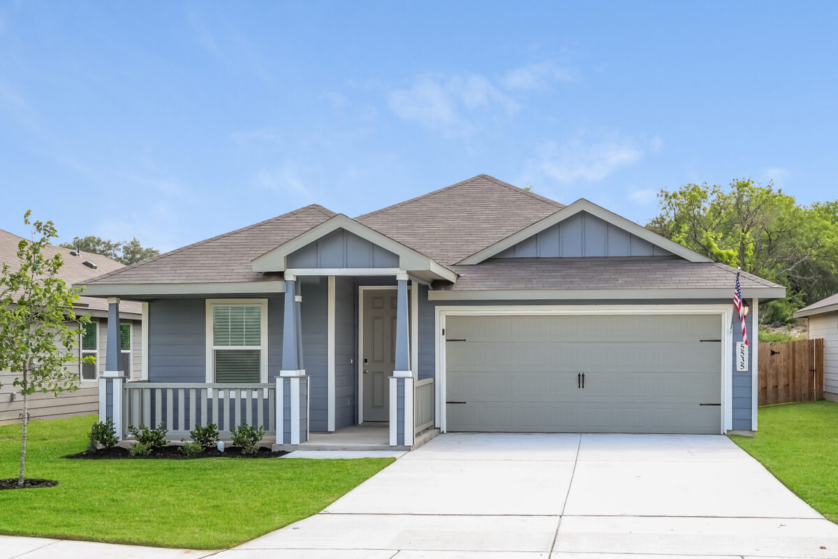 Front view of blue house with white trim