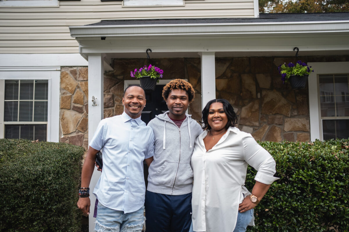 Family in front of home