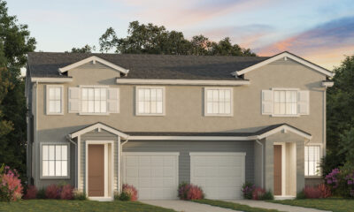 Exterior rendering of stucco townhome.