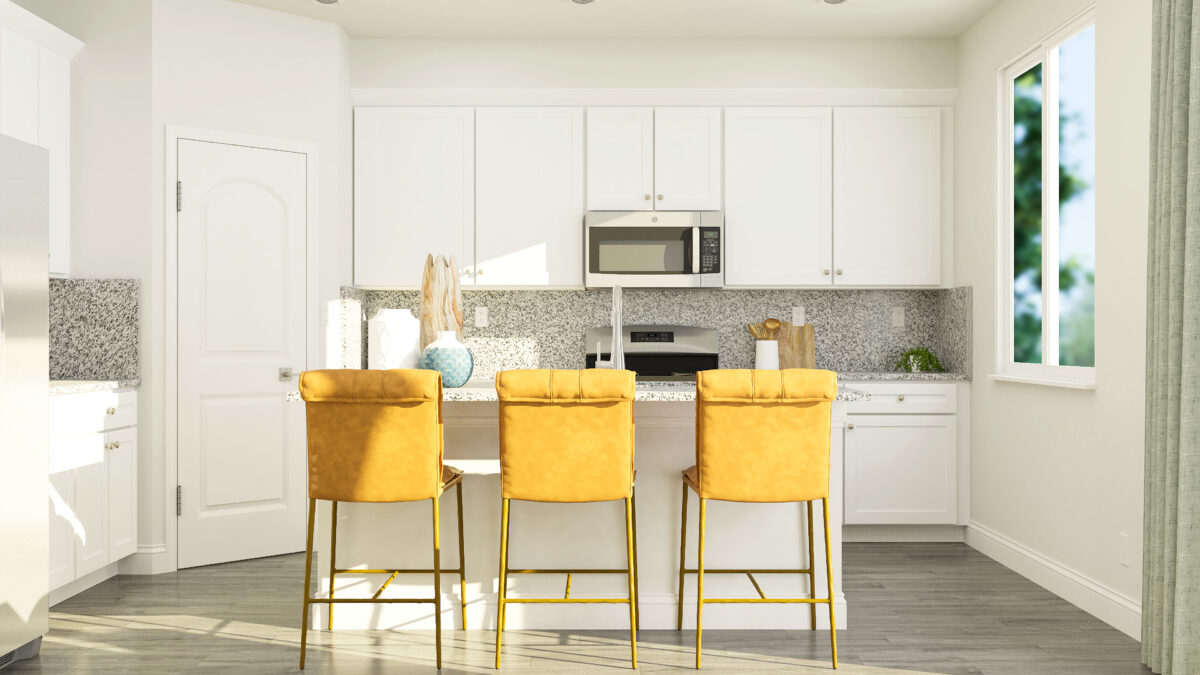 View of kitchen stools with white cabinets and granite countertops in the background.