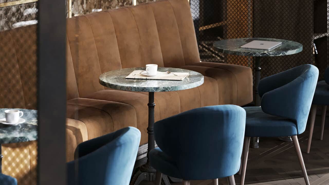 Shot of designer bistro tables and chairs and brown bench.