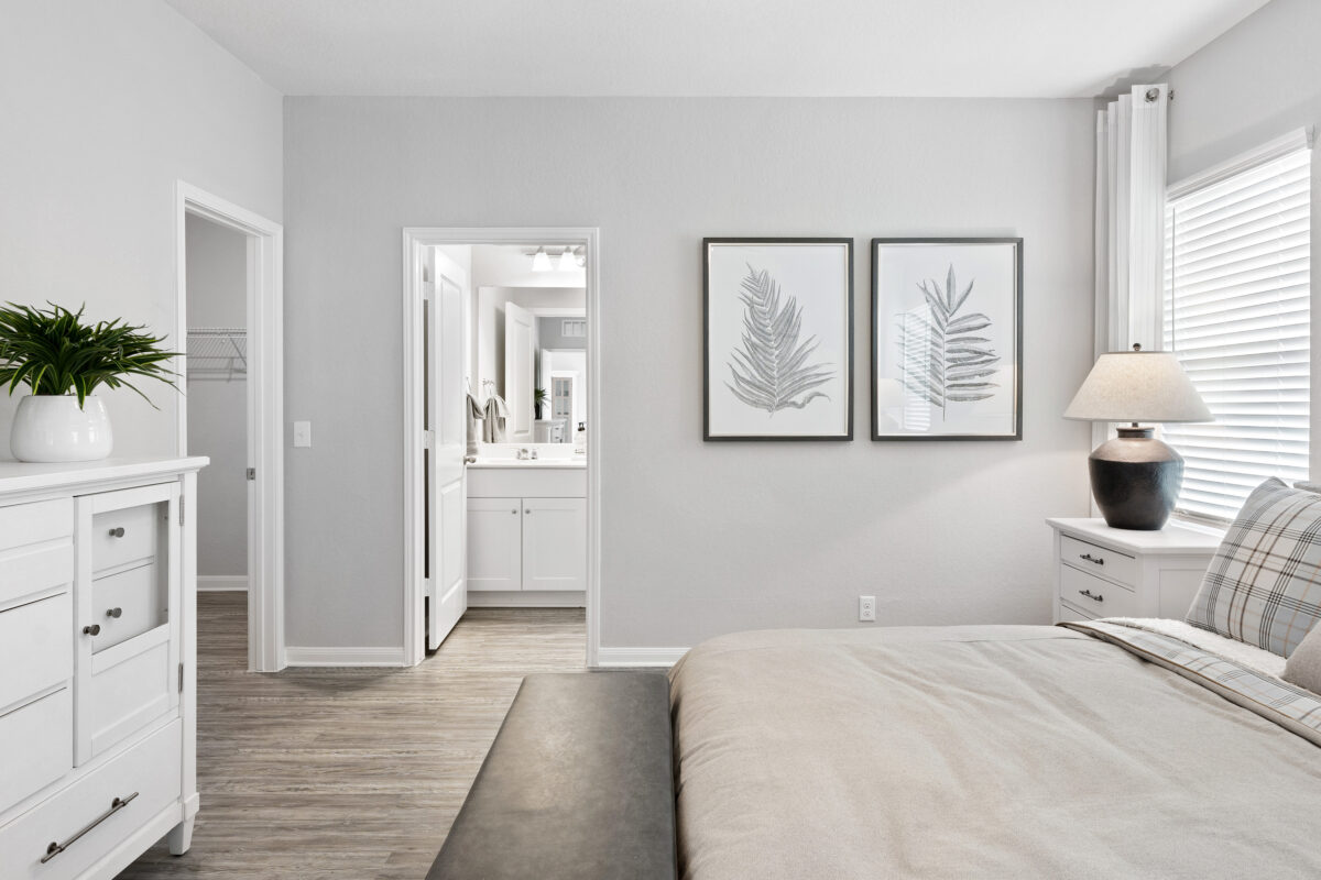 View of main bedroom and partial bathroom entrance.