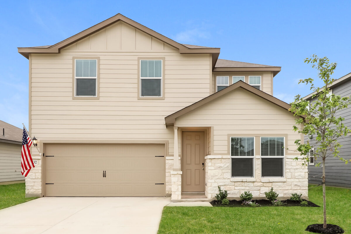 Front view of two story beige house