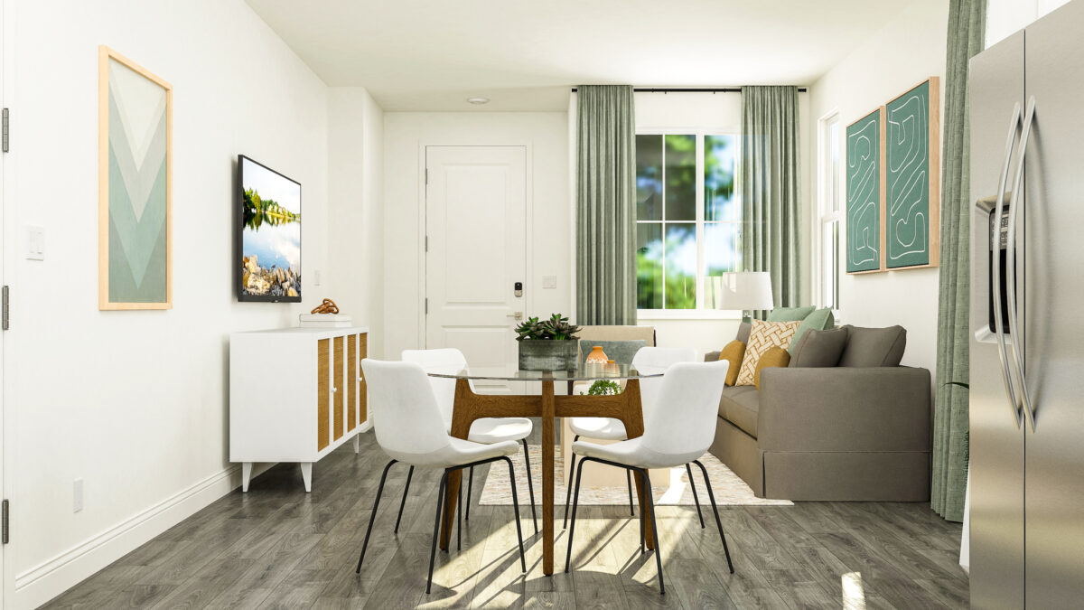 Staged rendering of dining area with focus on round dining table and living space in the background.