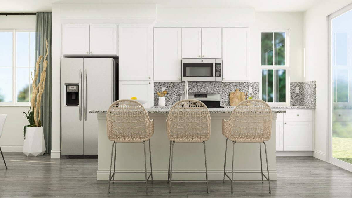 View of kitchen showing granite island and three stools with white cabinets and stainless steel appliances in the background.